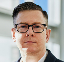 Führungskraft Alexander Hughes als CEO eines Krypto-Trading-Unternehmens im Porträt